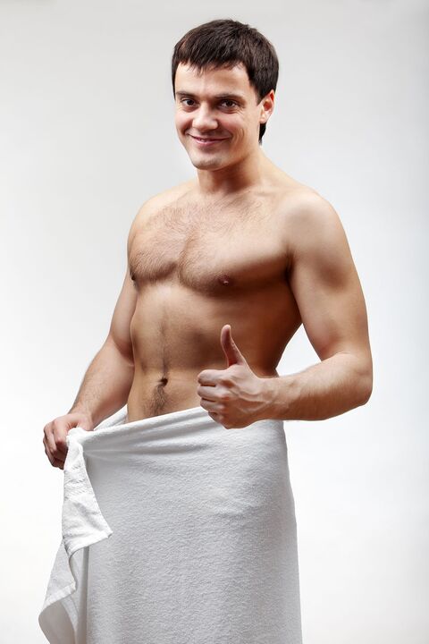 man in towel is satisfied with the increase in size of his penis